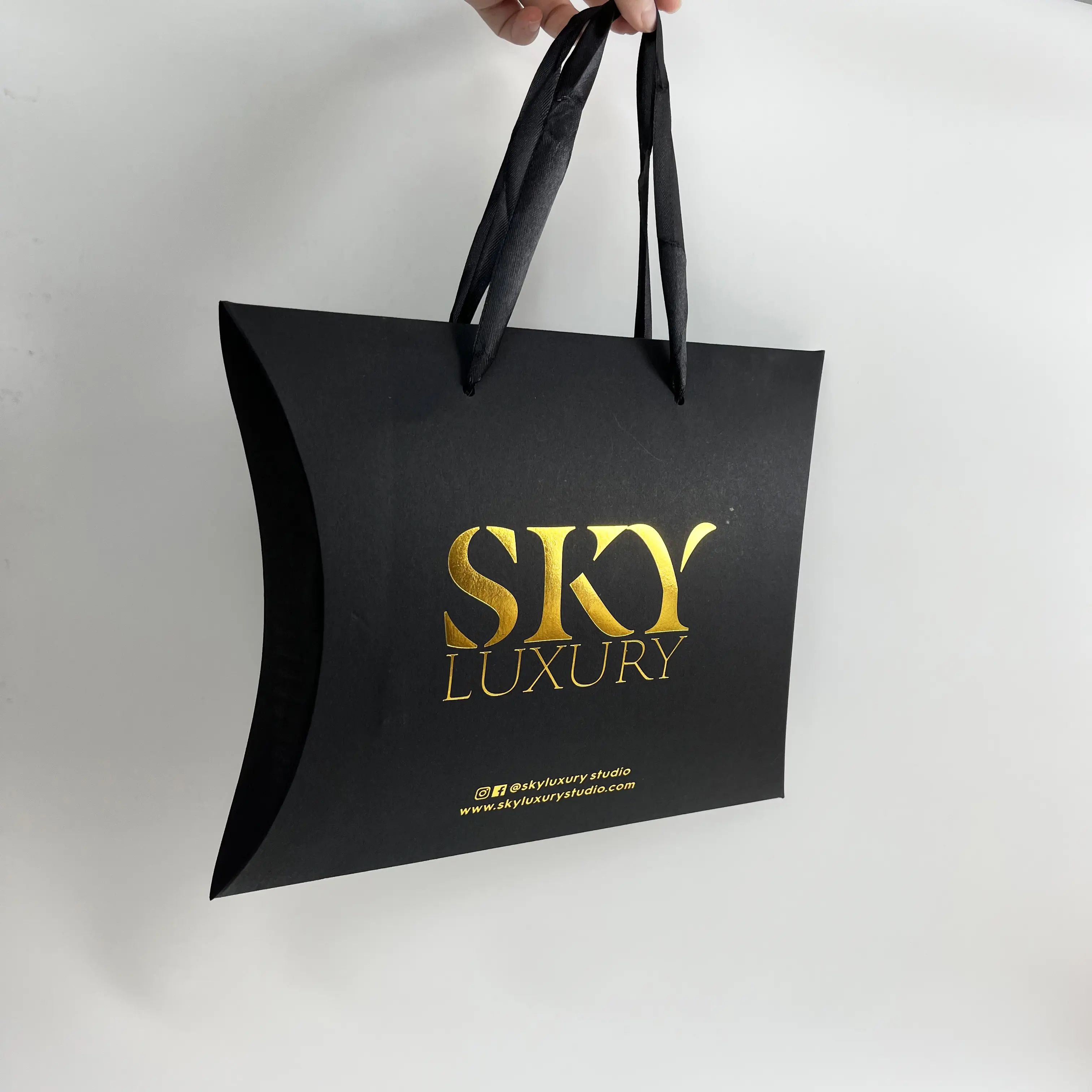 Luxury folding black paper bag with custom logo
