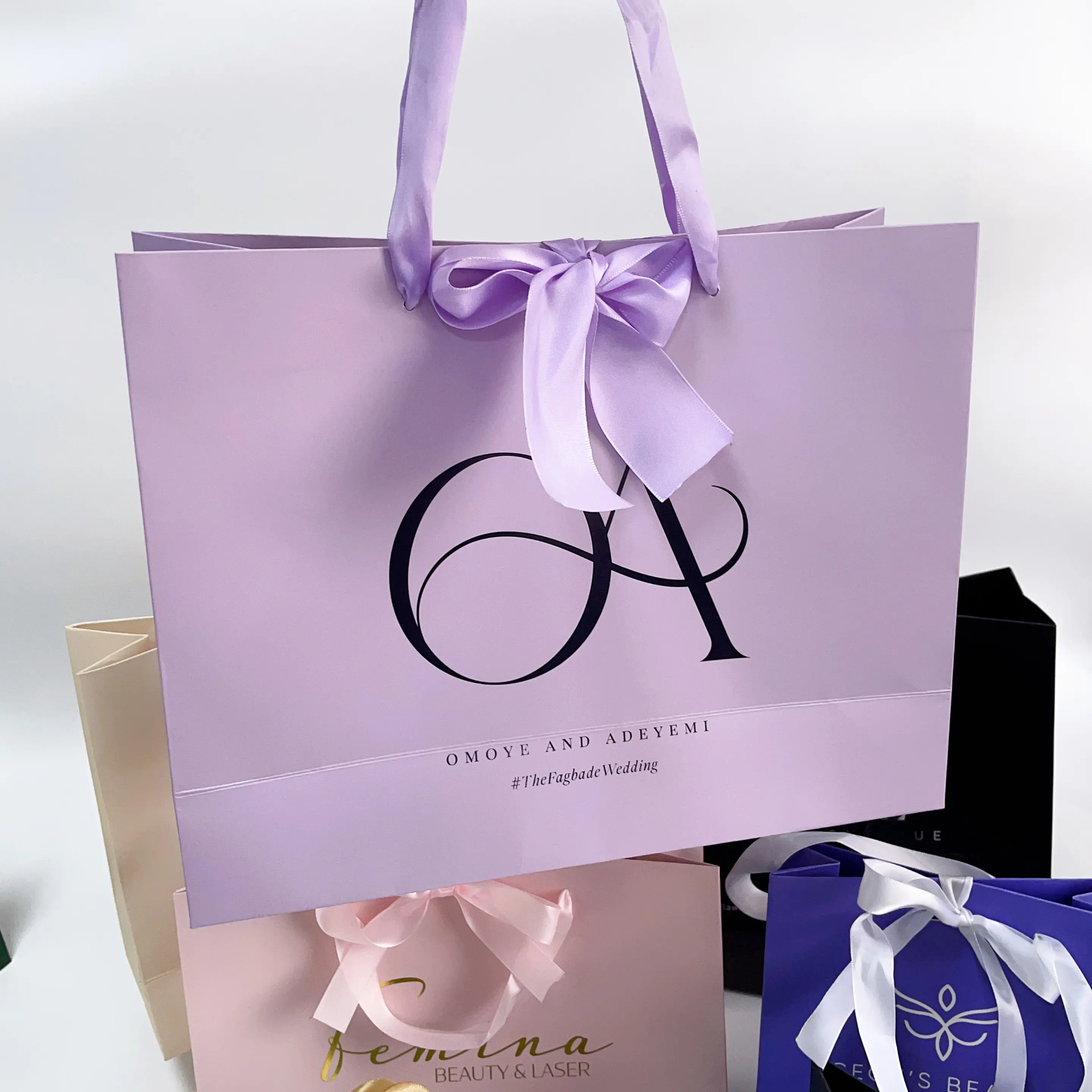 Purple paper shopping bag with custom logo printed